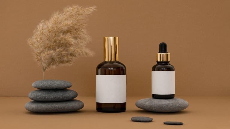 Two serum bottles containing niacinamide and vitamin c